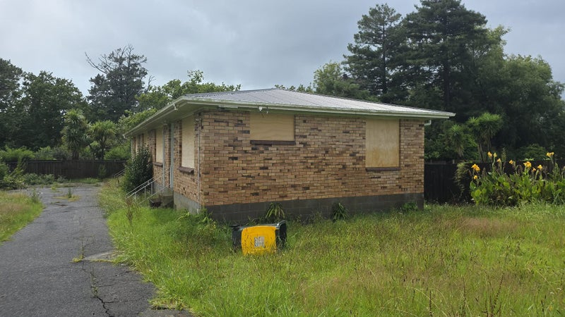 Exterior of one of the two bedroom units, showing the timber cladding to be replaced