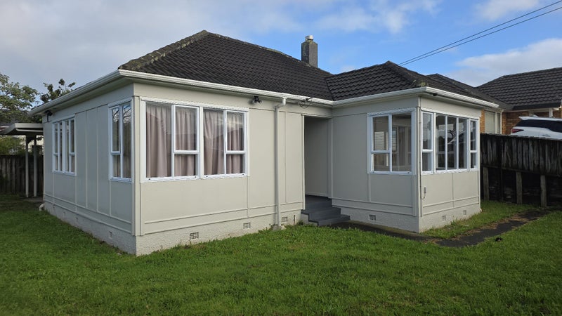 Exterior of the four bedroom home after repainting, with new aluminium joinery